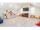 Spacious bonus room with neutral carpet, flat screen tv, and natural light from two windows at 2511 Pineway Dr, Burlington, NC 27215