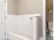 Convenient dog shower area featuring white subway tiles and adjacent toilet at 2511 Pineway Dr, Burlington, NC 27215