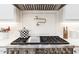 Kitchen cooktop featuring a professional range with a pot filler and a decorative tile backsplash at 2511 Pineway Dr, Burlington, NC 27215