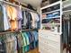 Organized walk-in closet featuring custom shelving and hanging racks for clothing and accessories at 2511 Pineway Dr, Burlington, NC 27215