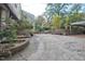 Expansive backyard featuring a patio, landscaping and a covered area at 2610 University Dr, Durham, NC 27707