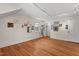 Bright bedroom with hardwood floors, white trim, and unique wall decor at 2610 University Dr, Durham, NC 27707