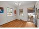 Inviting room featuring hardwood floors and access to an outdoor screened-in porch at 2610 University Dr, Durham, NC 27707