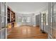 Spacious living room featuring hardwood floors, a bay window, and elegant french doors at 2610 University Dr, Durham, NC 27707