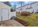View of townhouse backyard featuring lawn, small patio and shed at 3349 Tarleton W, Durham, NC 27713