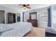 Cozy bedroom with blue walls, carpeted floors, and a ceiling fan at 3349 Tarleton W, Durham, NC 27713
