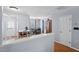Open-concept dining area with access to the back door and a view of the kitchen at 3349 Tarleton W, Durham, NC 27713