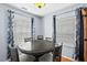 Cozy dining area with a round table, four chairs, and decorative curtains at 3349 Tarleton W, Durham, NC 27713