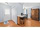 Bright dining area featuring a breakfast bar, table with chairs, and access to the back entrance at 3349 Tarleton W, Durham, NC 27713