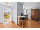 Dining area featuring a small island with seating and easy access to the backyard at 3349 Tarleton W, Durham, NC 27713