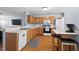 Spacious kitchen with a breakfast bar, stainless steel appliances, and an adjoining living area at 3349 Tarleton W, Durham, NC 27713