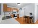 Charming kitchen featuring a breakfast bar, wooden cabinets, and lots of counter space at 3349 Tarleton W, Durham, NC 27713