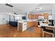 Open-concept kitchen with a breakfast bar, providing seamless flow into the living space for easy entertaining at 3349 Tarleton W, Durham, NC 27713