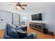 Bright living room with a large sofa, stylish armchairs, and a sleek media console at 3349 Tarleton W, Durham, NC 27713