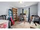 Office with a blue ladder, desk, storage, and natural light at 3349 Tarleton W, Durham, NC 27713