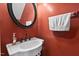 Stylish powder room with a unique vessel sink, and a decorative round mirror at 3349 Tarleton W, Durham, NC 27713
