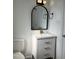 Contemporary bathroom with white vanity, gold hardware, and a stylish arched mirror at 3412 Rock Creek Dr, Raleigh, NC 27609