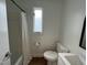 Clean bathroom featuring a bathtub with shower curtain, toilet, and vanity at 3412 Rock Creek Dr, Raleigh, NC 27609