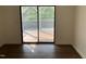 Bedroom featuring a large sliding glass door with a ceiling fan and hardwood floors at 3412 Rock Creek Dr, Raleigh, NC 27609