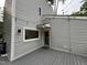Wood deck with railings and string lights in a lush green backyard setting at 3412 Rock Creek Dr, Raleigh, NC 27609