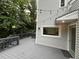 Wood deck with railings and string lights in a lush green backyard setting at 3412 Rock Creek Dr, Raleigh, NC 27609