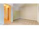 Neutral bedroom with carpet flooring, light walls, and a closet at 4100 Five Oaks Dr # 50, Durham, NC 27707