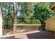 Wood deck overlooking a wooded area with mature trees and foliage at 4100 Five Oaks Dr # 50, Durham, NC 27707