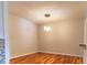 Formal dining room with hardwood floors and contemporary lighting fixture at 4100 Five Oaks Dr # 50, Durham, NC 27707