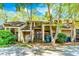Charming condo exterior with wood siding, a deck, and mature landscaping at 4100 Five Oaks Dr # 50, Durham, NC 27707