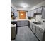 Well-lit kitchen featuring modern appliances, stylish countertops, and updated cabinets at 4100 Five Oaks Dr # 50, Durham, NC 27707