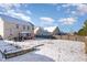 Snowy backyard featuring a wooden fence, patio set, and a lovely gazebo, perfect for outdoor gatherings at 4204 Vineyard Ridge Dr, Zebulon, NC 27597