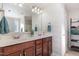Bathroom featuring a double vanity with a white countertop and dark cabinets, offering ample space at 4204 Vineyard Ridge Dr, Zebulon, NC 27597