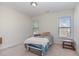 Cozy bedroom with two windows and neutral colors at 4204 Vineyard Ridge Dr, Zebulon, NC 27597