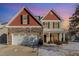 Inviting two-story home featuring a stone facade and an attached two-car garage at 4204 Vineyard Ridge Dr, Zebulon, NC 27597
