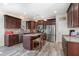 Modern kitchen featuring stainless steel appliances, granite countertops, and a stylish island with seating at 4204 Vineyard Ridge Dr, Zebulon, NC 27597