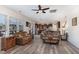 Open concept living room boasts wood floors and a seamless flow into the kitchen and dining area at 4204 Vineyard Ridge Dr, Zebulon, NC 27597