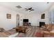 Bright living room with a cozy fireplace and large windows for natural light and comfortable seating at 4204 Vineyard Ridge Dr, Zebulon, NC 27597
