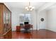 Inviting home office featuring hardwood floors, a spacious desk, and ample storage space at 4204 Vineyard Ridge Dr, Zebulon, NC 27597