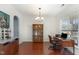 Home office with hardwood floors, natural light, a stylish chandelier, and a functional workspace at 4204 Vineyard Ridge Dr, Zebulon, NC 27597
