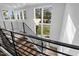 Staircase with chandelier and large window at 4208 Windsor Pl, Raleigh, NC 27609