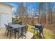 Backyard patio with furniture surrounded by a lush green lawn at 4555 Sugarbend Way, Raleigh, NC 27606