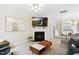 Cozy living room featuring a fireplace, mounted television, and open layout at 4555 Sugarbend Way, Raleigh, NC 27606