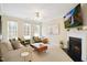 Bright living room featuring a fireplace, neutral walls, recessed lighting, and lots of natural light at 4555 Sugarbend Way, Raleigh, NC 27606