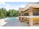 Stunning community pool and clubhouse featuring detailed stone work, multiple levels, and ample seating at 4555 Sugarbend Way, Raleigh, NC 27606