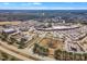 A drone shot of a townhome community with surrounding businesses, shopping and landscape at 507 Gateway Townes Blvd, Wake Forest, NC 27587