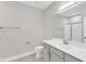 Bathroom with single vanity, white countertop, large mirror and a toilet at 507 Gateway Townes Blvd, Wake Forest, NC 27587
