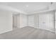 Spacious carpeted bedroom with neutral tones, tray ceiling, and double door closet for comfort and storage at 507 Gateway Townes Blvd, Wake Forest, NC 27587
