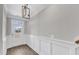 Front entryway with a modern light fixture and decorative wainscoting at 507 Gateway Townes Blvd, Wake Forest, NC 27587