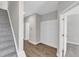 Hallway with wood flooring and shiplap wall next to the staircase at 507 Gateway Townes Blvd, Wake Forest, NC 27587