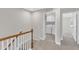 Upstairs hallway near the laundry room, offering convenience and easy access to bedrooms at 507 Gateway Townes Blvd, Wake Forest, NC 27587